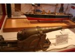 A small display model of HMS Warrior together with a very nicely modelled 7 inch muzzle loader of the type fitted to the ship.
